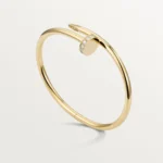 Cartier / JUSTE UN CLOU BRACELET Juste un Clou bracelet, classic, 18K yellow gold (750/1000), set with 32 brilliant-cut diamonds totaling 0.58 carat. Width: 3.5 mm (for size 17). - Image 3
